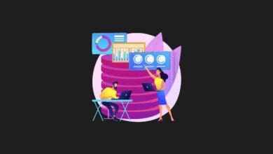 a man and woman working on laptops