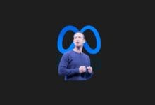 a man standing in front of a logo