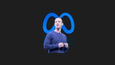 a man standing in front of a logo