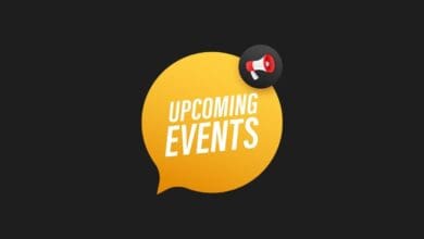 a yellow speech bubble with a megaphone and white text