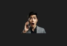 a man holding a phone to his ear